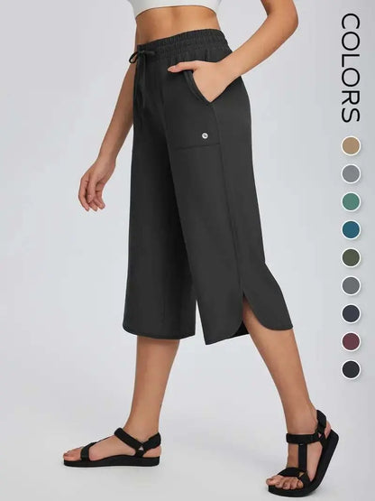 👖 Dámske capri nohavice na jogu so širokými nohavicami – vysoký pás s vreckami, rýchloschnúce, ľahké, ochrana pred slnkom UPF 50+ – voľné a pohodlné na turistiku, do posilňovne, na cestovanie a cvičenie vonku ☀️