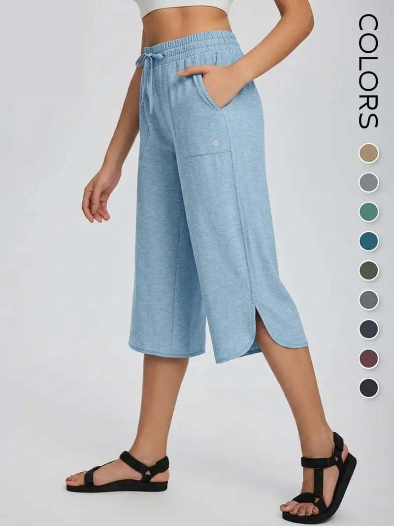 👖 Dámske capri nohavice na jogu so širokými nohavicami – vysoký pás s vreckami, rýchloschnúce, ľahké, ochrana pred slnkom UPF 50+ – voľné a pohodlné na turistiku, do posilňovne, na cestovanie a cvičenie vonku ☀️