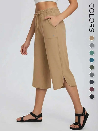 👖 Dámske capri nohavice na jogu so širokými nohavicami – vysoký pás s vreckami, rýchloschnúce, ľahké, ochrana pred slnkom UPF 50+ – voľné a pohodlné na turistiku, do posilňovne, na cestovanie a cvičenie vonku ☀️